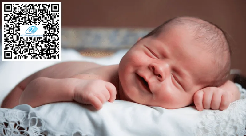 Sleeping newborn wrapped in a soft blanket during a Kansas City newborn photography session